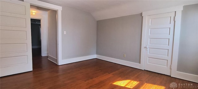289 Dayton Ave, Xenia, OH 45385 - unfurnished bedroom with wood finished floors and lofted ceiling