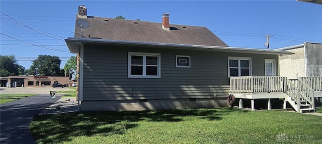 289 Dayton Ave, Xenia, OH 45385 - rear view of house with a lawn, a wooden deck, and a chimney