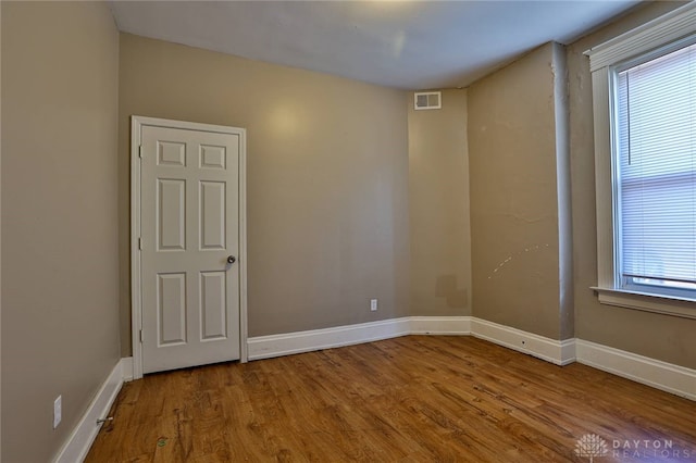 15 Bertus St, Cincinnati, OH 45217 - unfurnished room with plenty of natural light and wood finished floors