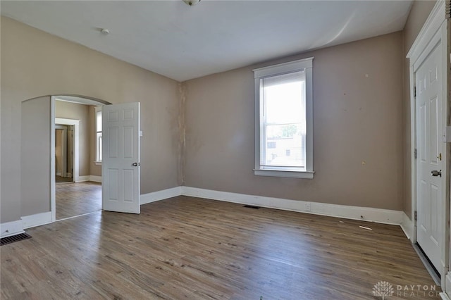 15 Bertus St, Cincinnati, OH 45217 - unfurnished bedroom featuring arched walkways and wood finished floors
