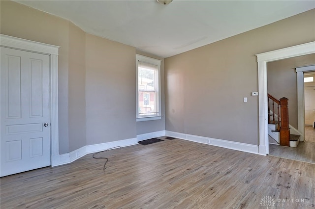 15 Bertus St, Cincinnati, OH 45217 - spare room featuring wood finished floors and stairway