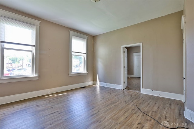 15 Bertus St, Cincinnati, OH 45217 - empty room with wood finished floors and healthy amount of natural light