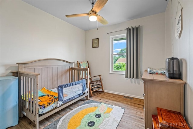 1227 Fyffe Ave, New Carlisle, OH 45344 - bedroom with wood finished floors and a ceiling fan