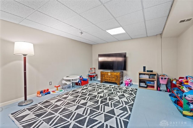 1227 Fyffe Ave, New Carlisle, OH 45344 - playroom featuring a drop ceiling and baseboards