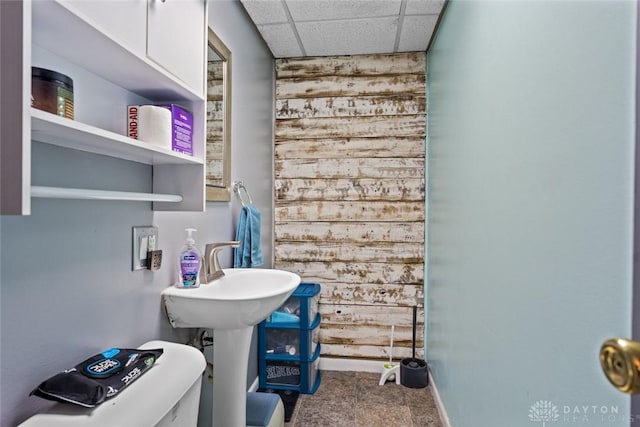 1227 Fyffe Ave, New Carlisle, OH 45344 - bathroom featuring a paneled ceiling and wooden walls