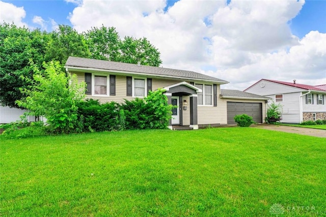 1227 Fyffe Ave, New Carlisle, OH 45344 - view of front of property with driveway, an attached garage, and a front yard