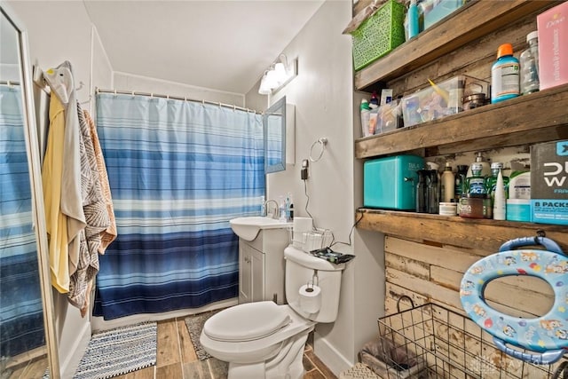 1227 Fyffe Ave, New Carlisle, OH 45344 - bathroom with vanity, wood finished floors, and a shower with shower curtain