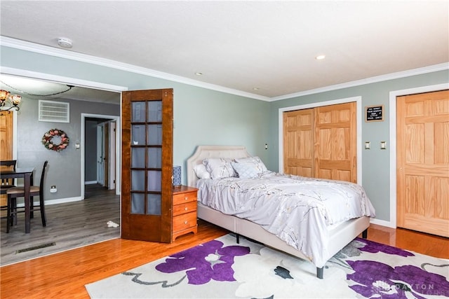 1221 Highview Dr, Fairborn, OH 45324 - bedroom with wood finished floors, ornamental molding, and a closet