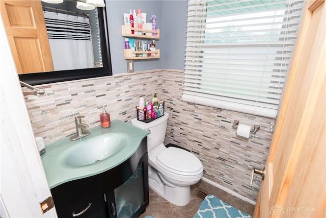 1221 Highview Dr, Fairborn, OH 45324 - bathroom with tile walls, tile patterned flooring, vanity, and curtained shower
