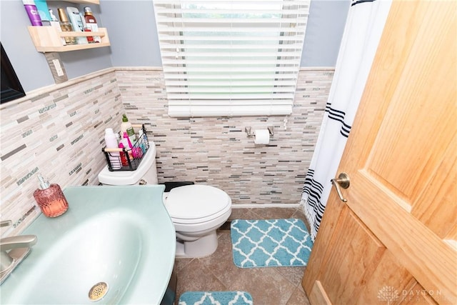 1221 Highview Dr, Fairborn, OH 45324 - bathroom with tile walls, tile patterned floors, and a wainscoted wall