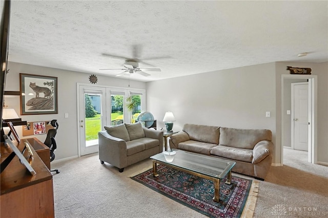 1720 Piper Ln Unit 104, Centerville, OH 45440 - living room featuring carpet floors, a ceiling fan, and a textured ceiling