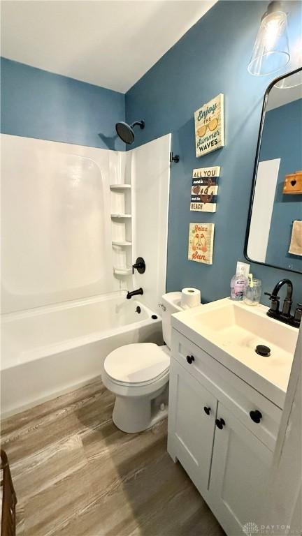 300 S Hayden Ave, Dayton, OH 45431 - full bathroom featuring vanity, wood finished floors, and shower / tub combination