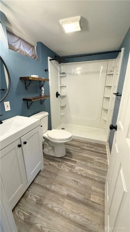 300 S Hayden Ave, Dayton, OH 45431 - bathroom featuring vanity, wood finished floors, and a shower