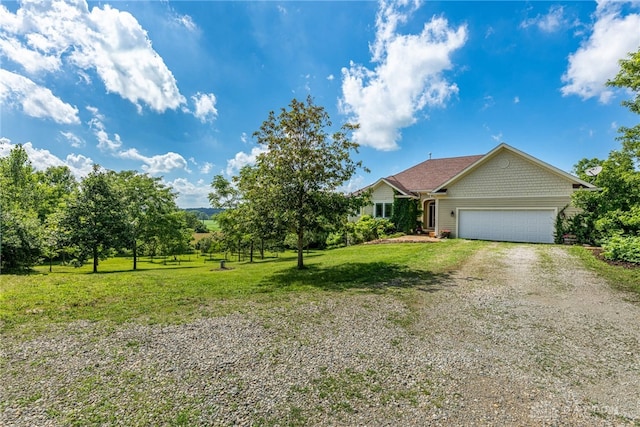 1590 Fairground Rd, Xenia, OH 45385 - view of front of house featuring driveway, a garage, and a front lawn