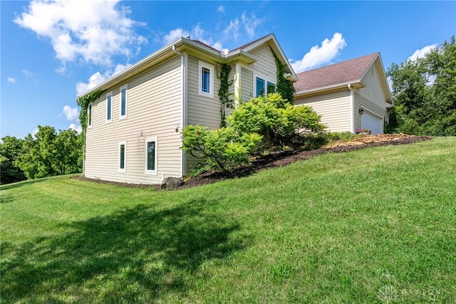 1590 Fairground Rd, Xenia, OH 45385 - view of side of property with an attached garage and a lawn