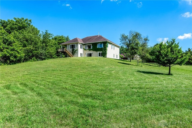 1590 Fairground Rd, Xenia, OH 45385 - view of green lawn with stairway and a wooden deck