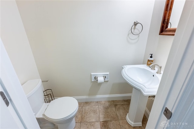 1590 Fairground Rd, Xenia, OH 45385 - half bath featuring toilet and tile patterned floors