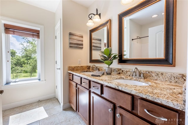 1590 Fairground Rd, Xenia, OH 45385 - full bathroom featuring double vanity and tile patterned floors