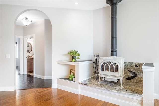 1590 Fairground Rd, Xenia, OH 45385 - detailed view of arched walkways, wood finished floors, and a wood stove