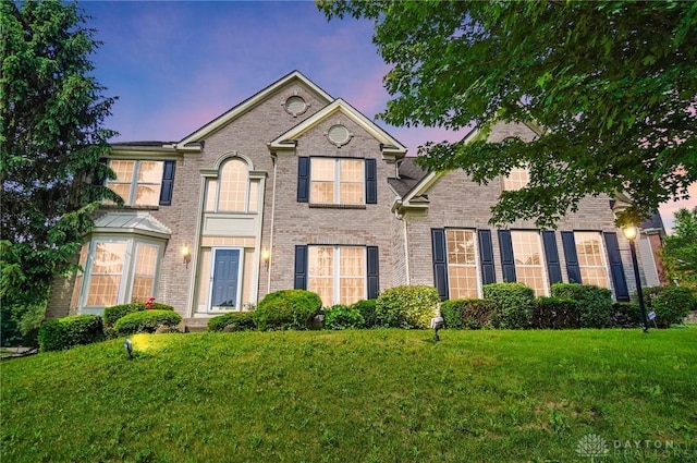 2435 Forest Oaks Dr, Beavercreek, OH 45431 - view of front of house with a lawn and brick siding
