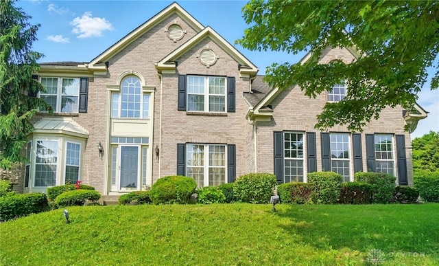 2435 Forest Oaks Dr, Beavercreek, OH 45431 - view of front of home featuring a front lawn and brick siding