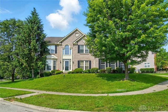 2435 Forest Oaks Dr, Beavercreek, OH 45431 - view of front facade with a front lawn and brick siding