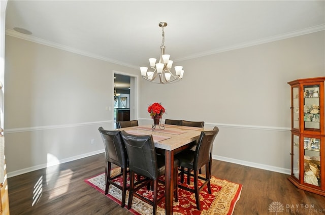 2435 Forest Oaks Dr, Beavercreek, OH 45431 - dining room with a chandelier, ornamental molding, and dark wood finished floors