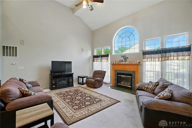 2435 Forest Oaks Dr, Beavercreek, OH 45431 - living room with high vaulted ceiling, a fireplace, a ceiling fan, and carpet