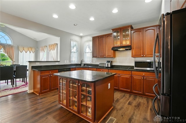 2435 Forest Oaks Dr, Beavercreek, OH 45431 - kitchen featuring appliances with stainless steel finishes, under cabinet range hood, dark wood-style floors, healthy amount of natural light, and recessed lighting