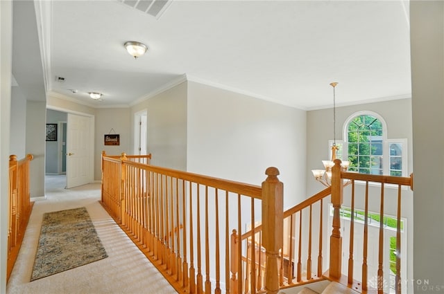 2435 Forest Oaks Dr, Beavercreek, OH 45431 - corridor with an upstairs landing, carpet flooring, ornamental molding, and a chandelier