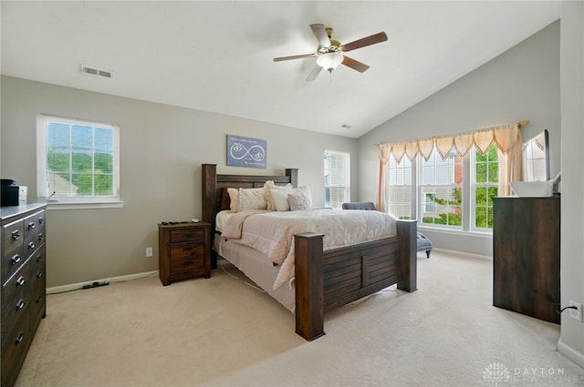 2435 Forest Oaks Dr, Beavercreek, OH 45431 - bedroom featuring multiple windows, light colored carpet, vaulted ceiling, and ceiling fan