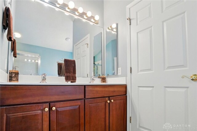 2435 Forest Oaks Dr, Beavercreek, OH 45431 - bathroom featuring double vanity and a shower