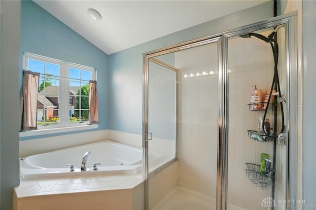 2435 Forest Oaks Dr, Beavercreek, OH 45431 - bathroom featuring vaulted ceiling, a garden tub, and a stall shower