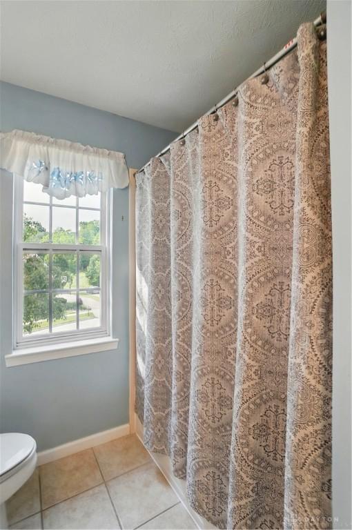 2435 Forest Oaks Dr, Beavercreek, OH 45431 - full bath featuring tile patterned flooring and a shower with shower curtain
