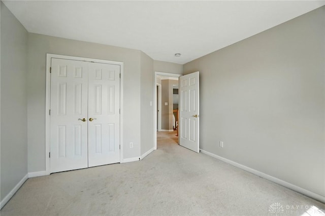 2435 Forest Oaks Dr, Beavercreek, OH 45431 - unfurnished bedroom featuring carpet floors and a closet