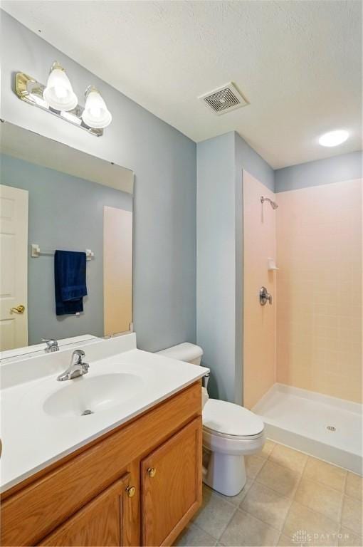 2435 Forest Oaks Dr, Beavercreek, OH 45431 - bathroom featuring vanity, a stall shower, and tile patterned flooring