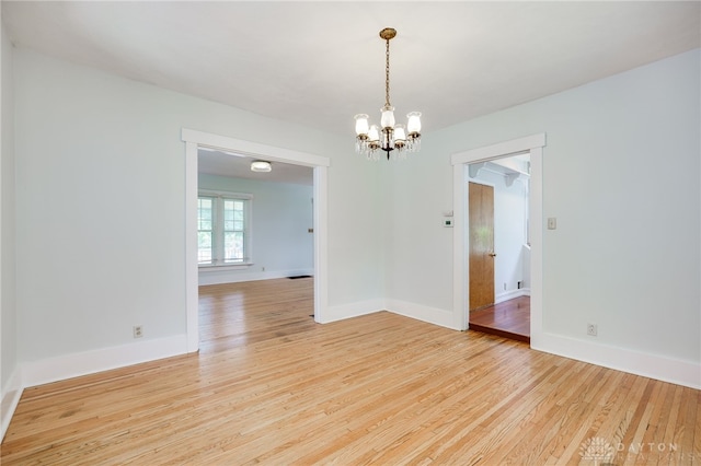 25 Laura Ave, Dayton, OH 45405 - spare room featuring a chandelier and light wood-style floors