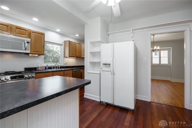 25 Laura Ave, Dayton, OH 45405 - kitchen featuring appliances with stainless steel finishes, dark countertops, dark wood-style floors, a chandelier, and recessed lighting