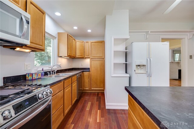 25 Laura Ave, Dayton, OH 45405 - kitchen with appliances with stainless steel finishes, dark countertops, dark wood-type flooring, and recessed lighting