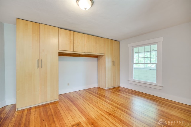 25 Laura Ave, Dayton, OH 45405 - unfurnished bedroom featuring light wood finished floors and a closet