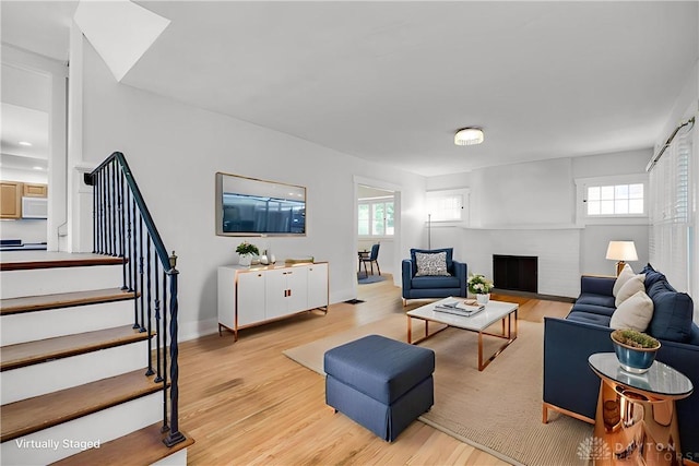 25 Laura Ave, Dayton, OH 45405 - living area with plenty of natural light, light wood-style flooring, and stairway