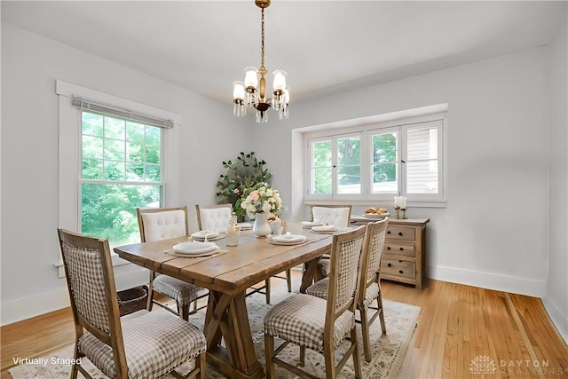 25 Laura Ave, Dayton, OH 45405 - dining room featuring a chandelier and light wood-style flooring