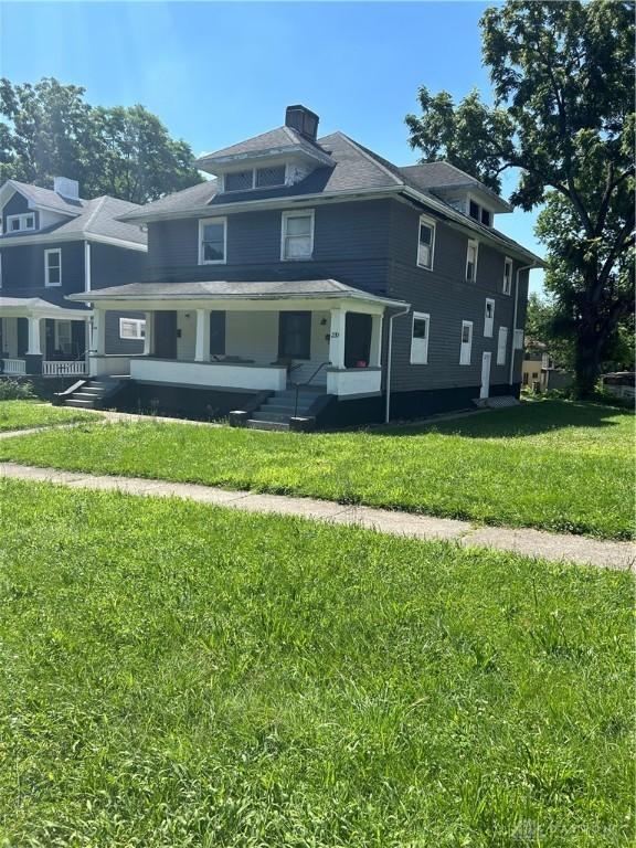 230 Oxford Ave Unit 228, Dayton, OH 45402 - traditional style home featuring a front lawn and a chimney