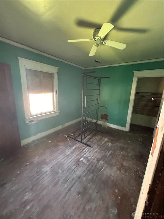 230 Oxford Ave Unit 228, Dayton, OH 45402 - unfurnished bedroom with hardwood / wood-style floors, crown molding, and a ceiling fan