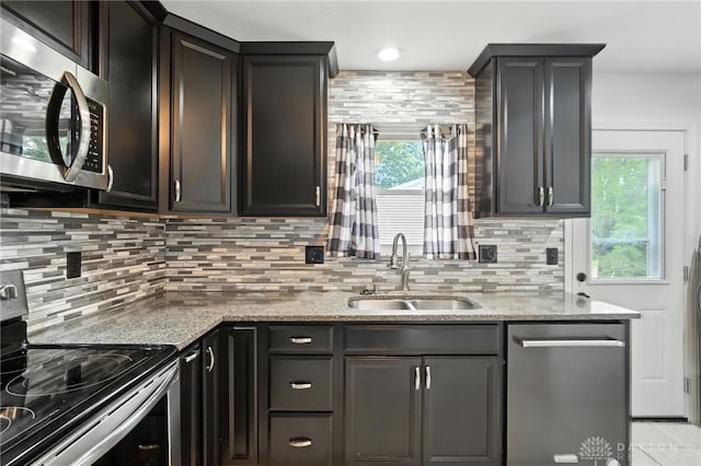 5 Bayberry Dr, Springboro, OH 45066 - kitchen with stainless steel appliances, decorative backsplash, and light stone counters