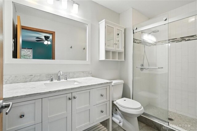 5 Bayberry Dr, Springboro, OH 45066 - bathroom featuring a shower stall, vanity, tile patterned flooring, and a ceiling fan