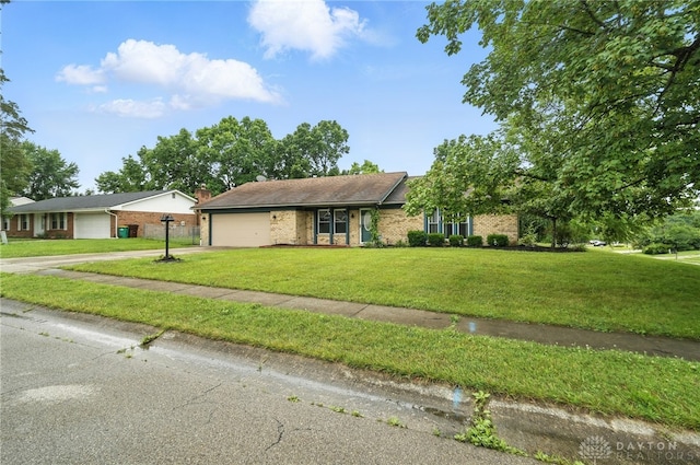 5 Bayberry Dr, Springboro, OH 45066 - single story home with brick siding, an attached garage, driveway, and a front yard