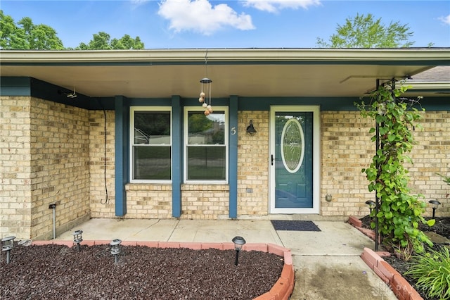 5 Bayberry Dr, Springboro, OH 45066 - view of exterior entry featuring brick siding and a porch