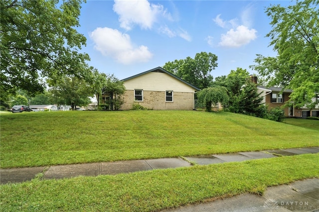 5 Bayberry Dr, Springboro, OH 45066 - view of side of property featuring brick siding and a lawn