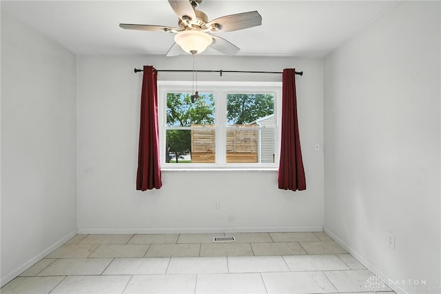 5 Bayberry Dr, Springboro, OH 45066 - tiled spare room featuring a ceiling fan and baseboards